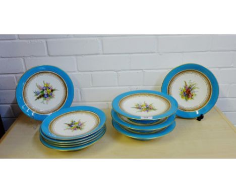 A Royal Worcester dessert service painted with Hollyhocks and other flowers within a gilt edged and pale blue border, compris