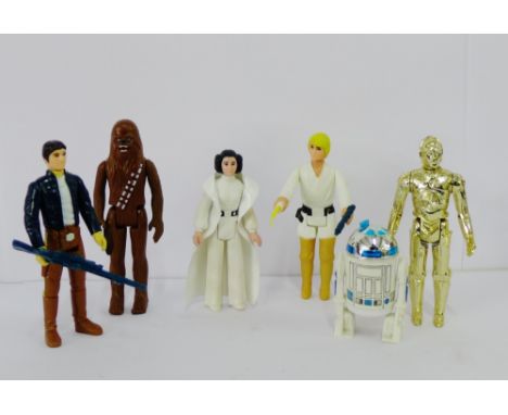 A collection of vintage Star Wars figures to include a 1977 Luke Skywalker and Princess Leia, R2D2, C-3PO,  Chewbacca, etc., 