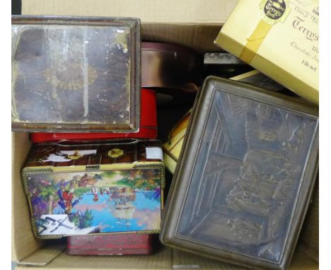 A carton containing a selection of vintage tins