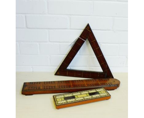 A collection of three 19th century and later cribbage boards to include a triangular board and two others, (3) 