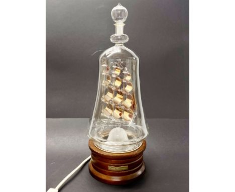 A glass ship in a bottle table lamp, H. 41cm.