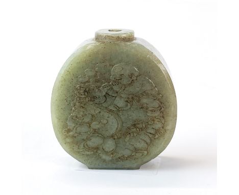A Chinese carved jade snuff bottle decorated with children playing instruments, H. 6.1cm.