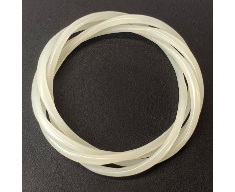 A rare Chinese milk glass four piece bangle imitating white jade. Each bangle 4mm, internal dia. 6cm.