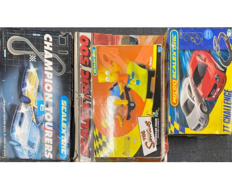 Six boxed Scalextric sets.