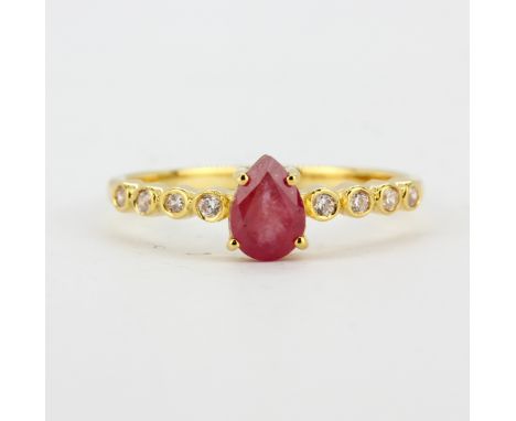 A gold on 925 silver ring set with a pear cut ruby and white topaz set shoulders, (N.5).