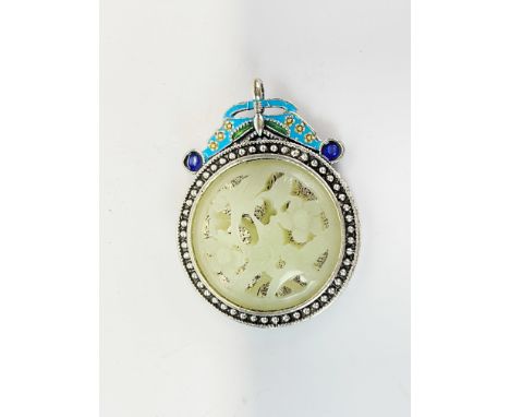 A Chinese enamelled white metal pendant inset with carved jade, Dia. 5cm H. 7cm.
