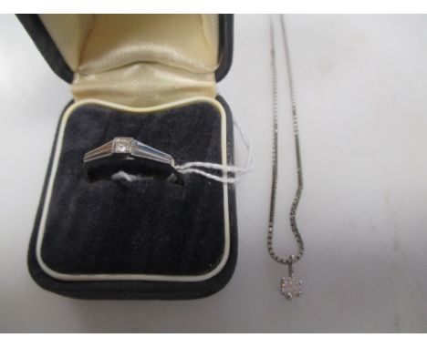 A solitaire diamond pendant, the round brilliant cut diamond approx. 0.2cts, claw mounted in white gold stamped 585, on a box