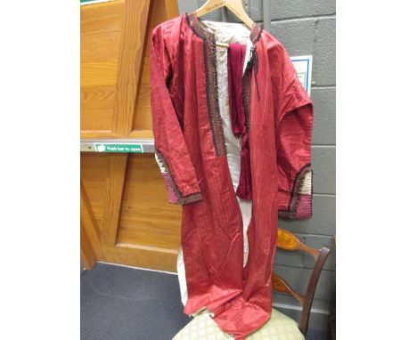 A gentleman's evening jacket with a military sash  