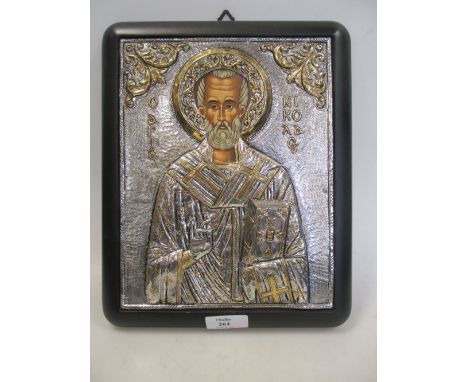 A modern Greek Orthodox white metal and gold plated reproduction of a Byzantine icon with painted underpanel, 22.75 x 18cm  