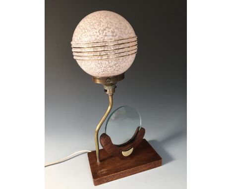 An Art Deco oak and brass table lamp and photograph frame, the circular glass photograph holder to an oak base with applied l