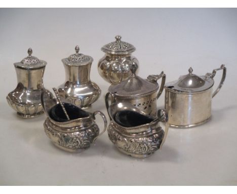 A pepperette or pounce pot with lobed baluster body on a circular foot, 8cm, marks rubbed, an oval mustard pot of plain form,