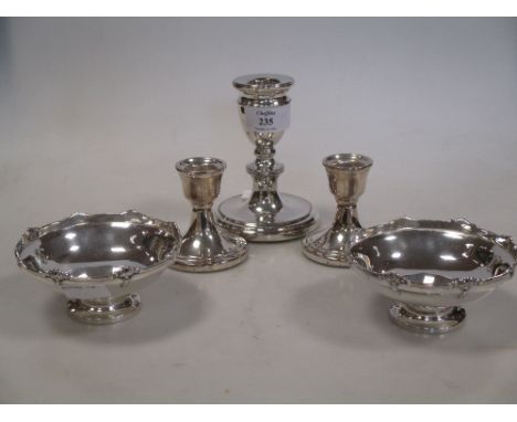 A pair of silver bon bon dishes, a pair of dwarf candlesticks and a single candlestick  