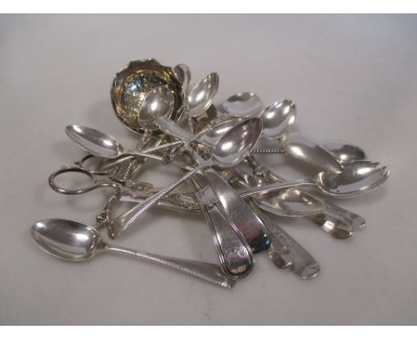 A pair of sugar nips with shell grips, Sheffield 1881, maker TS & S, a caddy spoon with bright cut decoration, date letter on