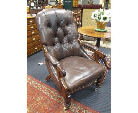 A Victorian brown leather upholstered button back armchair  