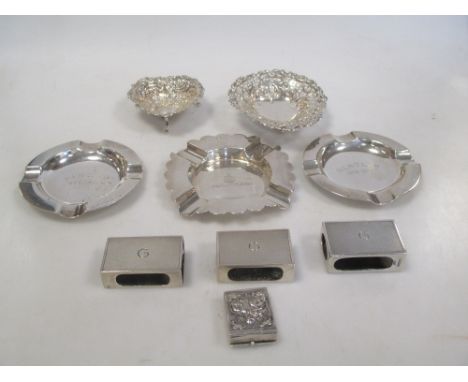 Three silver ashtrays, two circular, the other shaped, Birmingham 1931 and Chester 1894 respectively, both with engraved init