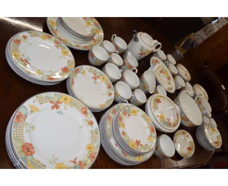 An extensive Wedgwood dinner service in the trellis flower pattern including 8 dinner plates, side plates, serving tureen and