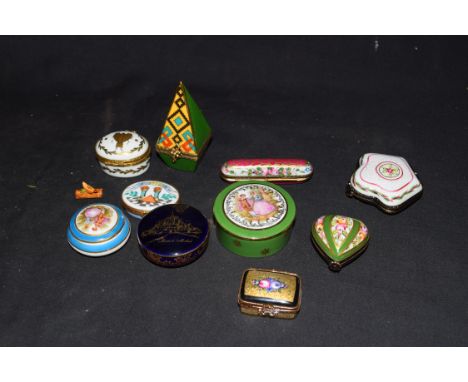 Collection of Limoges and other French porcelain and enamel decorated pill and trinket boxes to include an obelisk formed exa