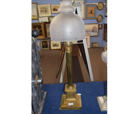 Palmer &amp; Co patent oil lamp fitted with frosted glass shade with star cut decoration, raised on a stepped square brass ba