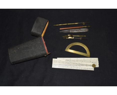 Shagreen cased composite set of technical drawing instruments to include folding ivory ruler, brass protractor and other asso