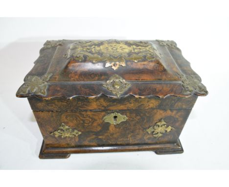 Mid-19th century painted papier mache tea caddy of shaped rectangular form, the painted decoration to simulate burr walnut an