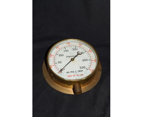 Vintage brass cased pressure gauge with scale in pounds per inch and feet of water, no maker's name apparent, 15cm max diam