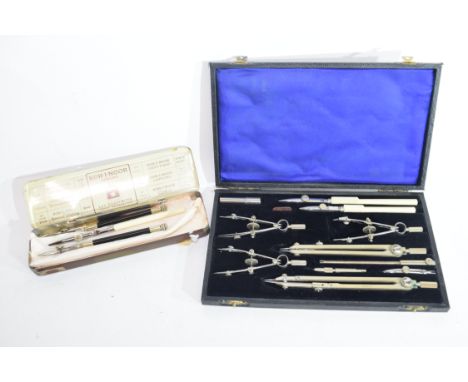 A cased technical drawing set, the dividers impressed WHH Ltd in original fitted case, together with a tin containing further