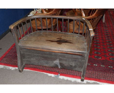 19th century elm seated small settle or hall chair with bow and stick back raised on shaped front feet and plain back feet, 1