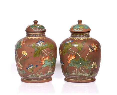 A pair of Chinese Xin stone ware vases and covers 19th Century each decorated with kingfisher in raised colour enamels with l