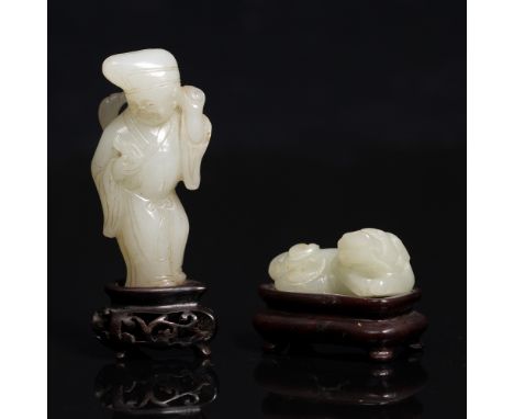 A Chinese figure of a standing youth 19th Century holding a hossu, 6cm with carved wood stand and a Chinese white jade carvin