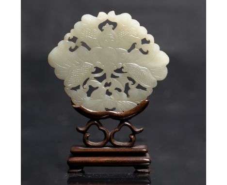 A Chinese greyish white jade plaque 19th Century pierced and carved as a butterfly and a peony flowers on a wood stand, 9.5cm