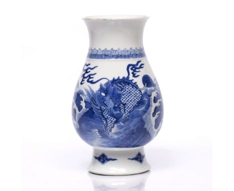 A Chinese blue and white porcelain baluster vase 19th Century decorated mythological beast standing amidst wave washed rocks,