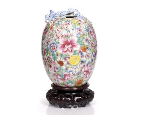 A Chinese famille rose enamel vase early 20th Century with mille-fleur decoration and dragon around the neck, Qianlong mark, 