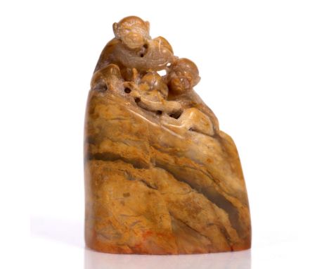 A Chinese soap stone carved seal in the form of monkeys, 8cm high