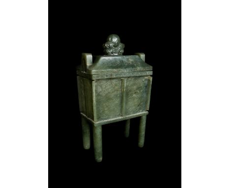 A Chinese leaf green jade archaic bronze style ting 19th Century the rectangular body on four cylindrical feet and with arch 