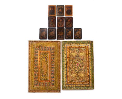 A pair of hand painted Qajar panels and a collection of Qajar playing cards