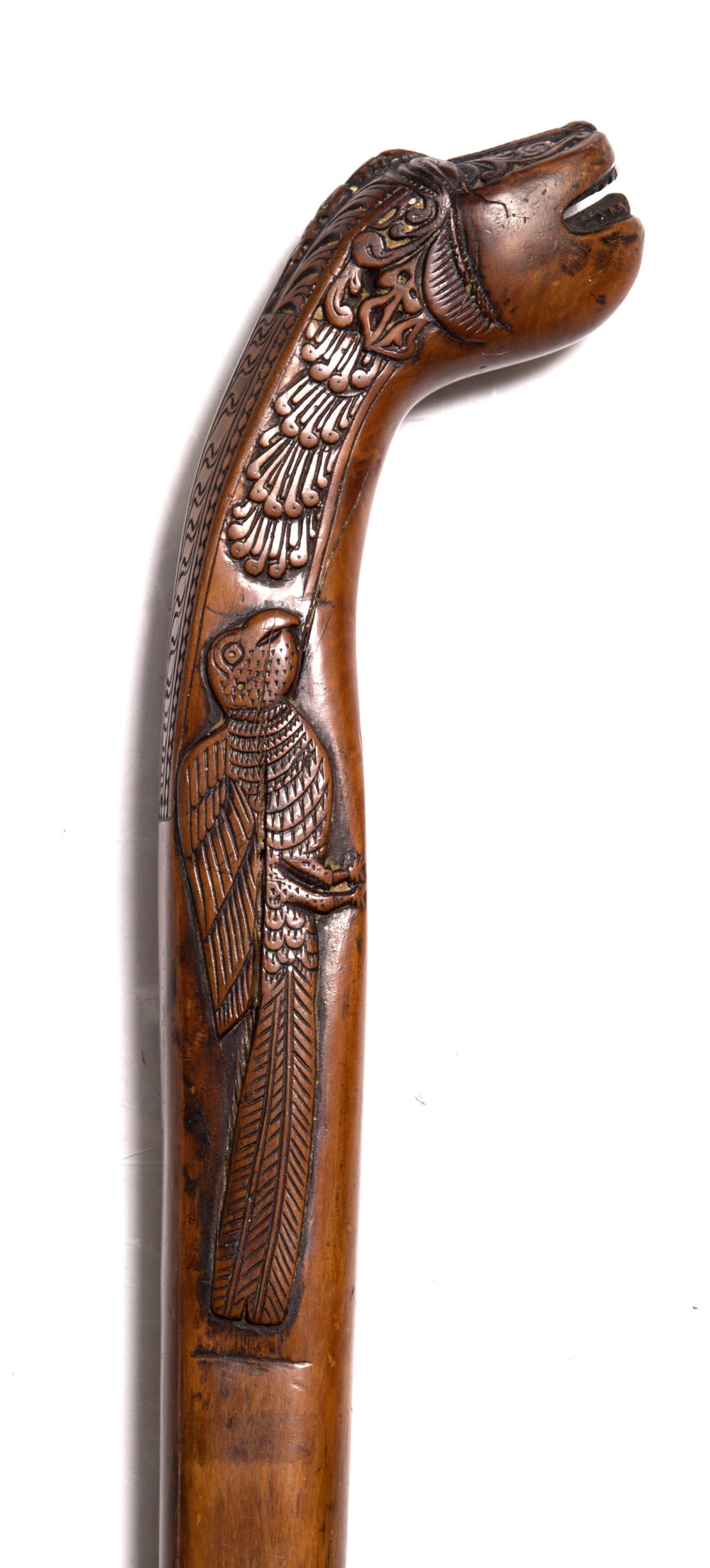 A Sri Lankan fruitwood walking stick 19th Century carved with a makara