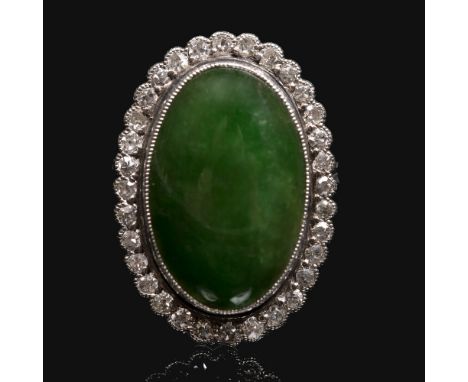 A Chinese jade and diamond cluster ring of oval cabochon form Accompanied by a testing report from The Jewellery Trade Labora