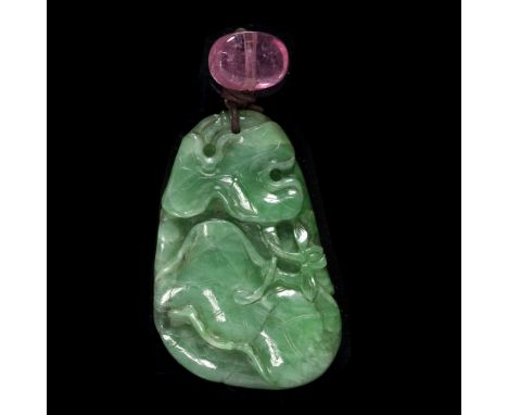 A Chinese carved jade pendant of lotus leaf form,4.7cm x 5cm