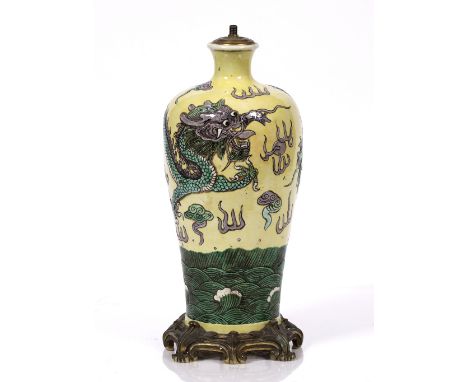 A Chinese yellow ground vase 19th Century mounted as a table lamp, and decorated in famille verte with dragon and flaming pea