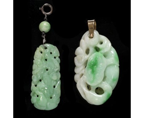 A Chinese white and emerald green jadeite pendant pierced and carved as a fish and lotus plant with pod and flowers, gold col