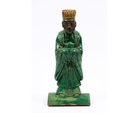 A Chinese tile guardian figure in the Ming style 31cm high