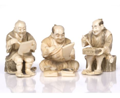 A Japanese set of three ivory okimono  Masamitsu ? 1900-1920 carved as seated gentlemen, one eating, another writing on a pad