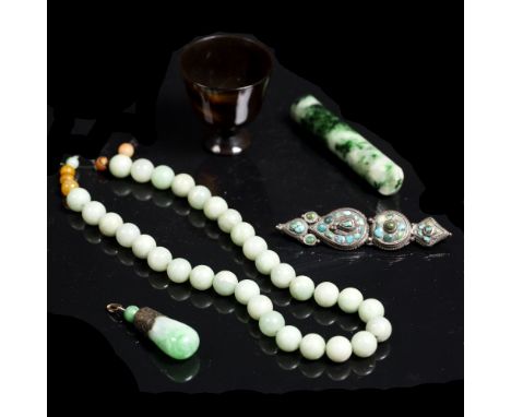 A group of Chinese pieces  to include a jade necklace, a turquoise brooch, an agate small wine cup and one other piece