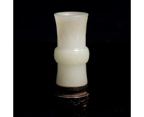A Chinese jade miniature vase 19th Century of Gu form, hardwood stand, 5cm From a private Oxfordshire collection.