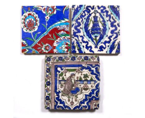 An Iznik tile decorated with peony flowers and two other Middle Eastern tiles, each approx. 20cm x 20cm (3)