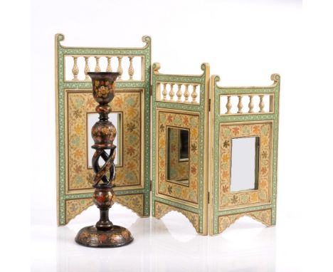 A Kashmir painted folding dressing table mirror and a hand painted large candlestick (2)