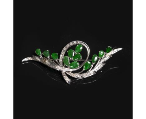 A jade and diamond spray brooch