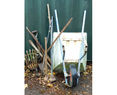A fire basket, various tools, malletts, hoppers etc and a wheelbarrow 