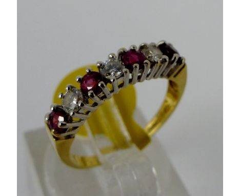 Ruby and diamond 18ct yellow gold ring, size J/K. W: 2.18g