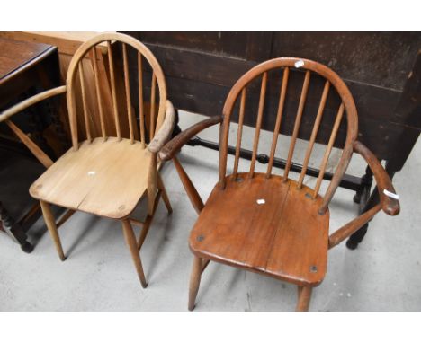 Two vintage hoop and stick back carver chairs, one marked Ercol, the other having been stripped but most likely also Ercol